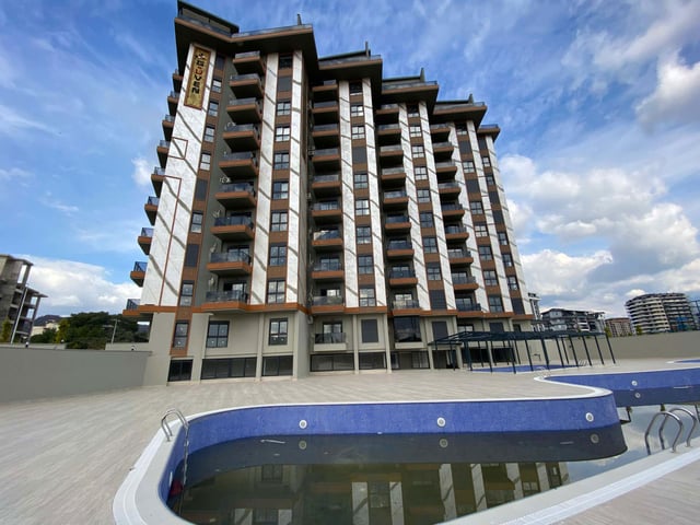 BOTANİK SİTESİNDE HAVUZ VE DENİZ MANZARALI GENİŞ 1+1  KÖŞE DAİRE